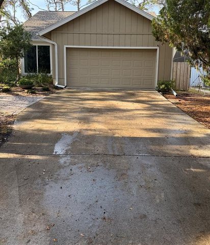 Driveway — pressure washed before cleaning by Seen and Clean