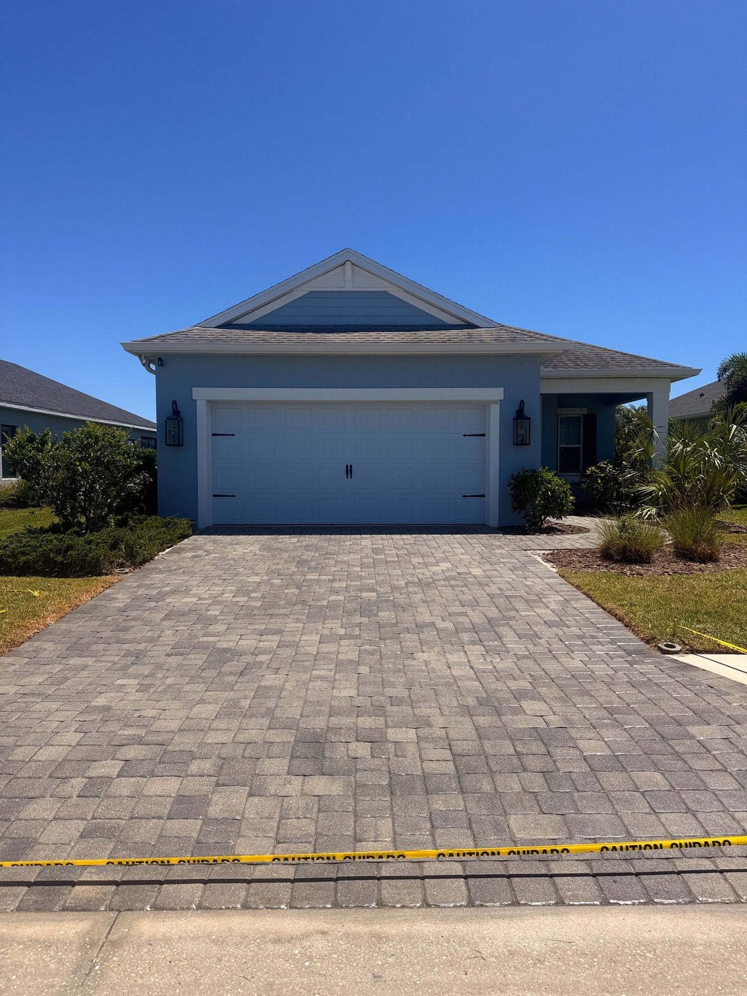 Rich, sealed paver driveway after restoration by Seen and Clean