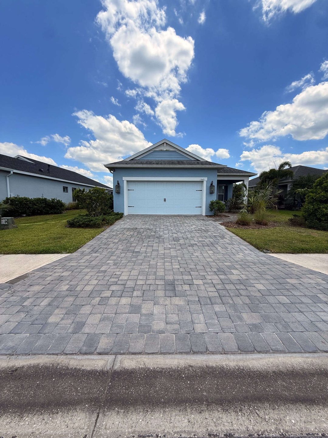 Faded paver driveway before sealing in Manatee County